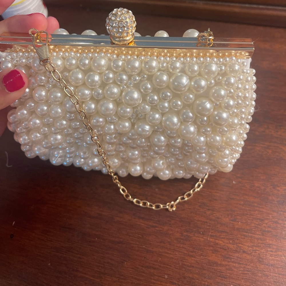 Pearl clutched small purse